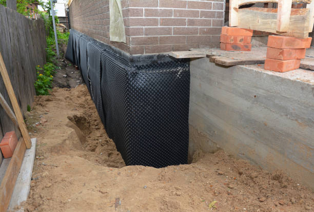 Happy homeowners after waterproofing job in Moody